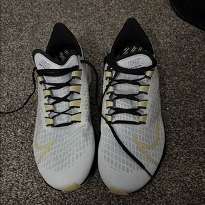 New Orleans Saints Nike White and Black Running Shoes with Gold Accents